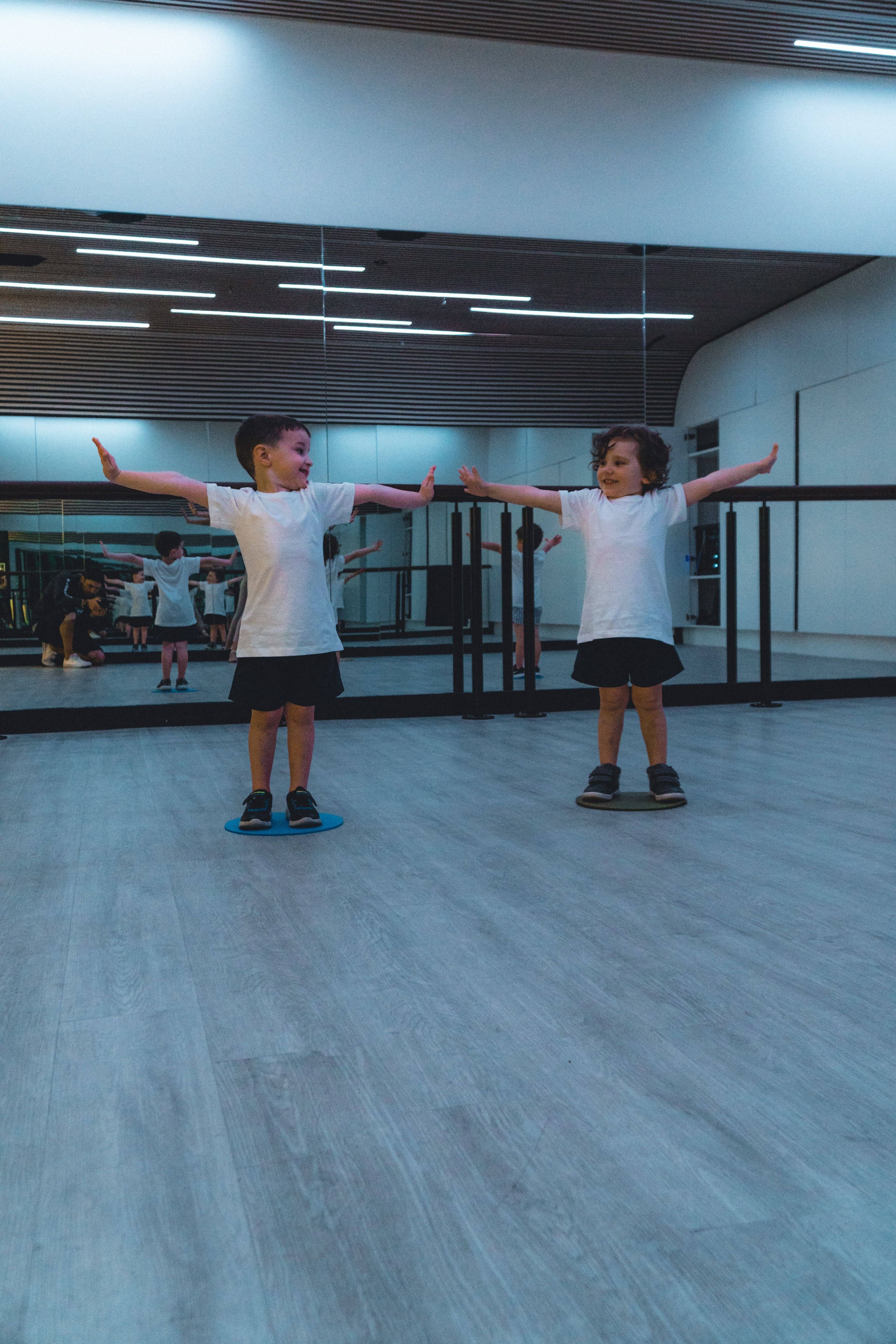 Boys extending arms together