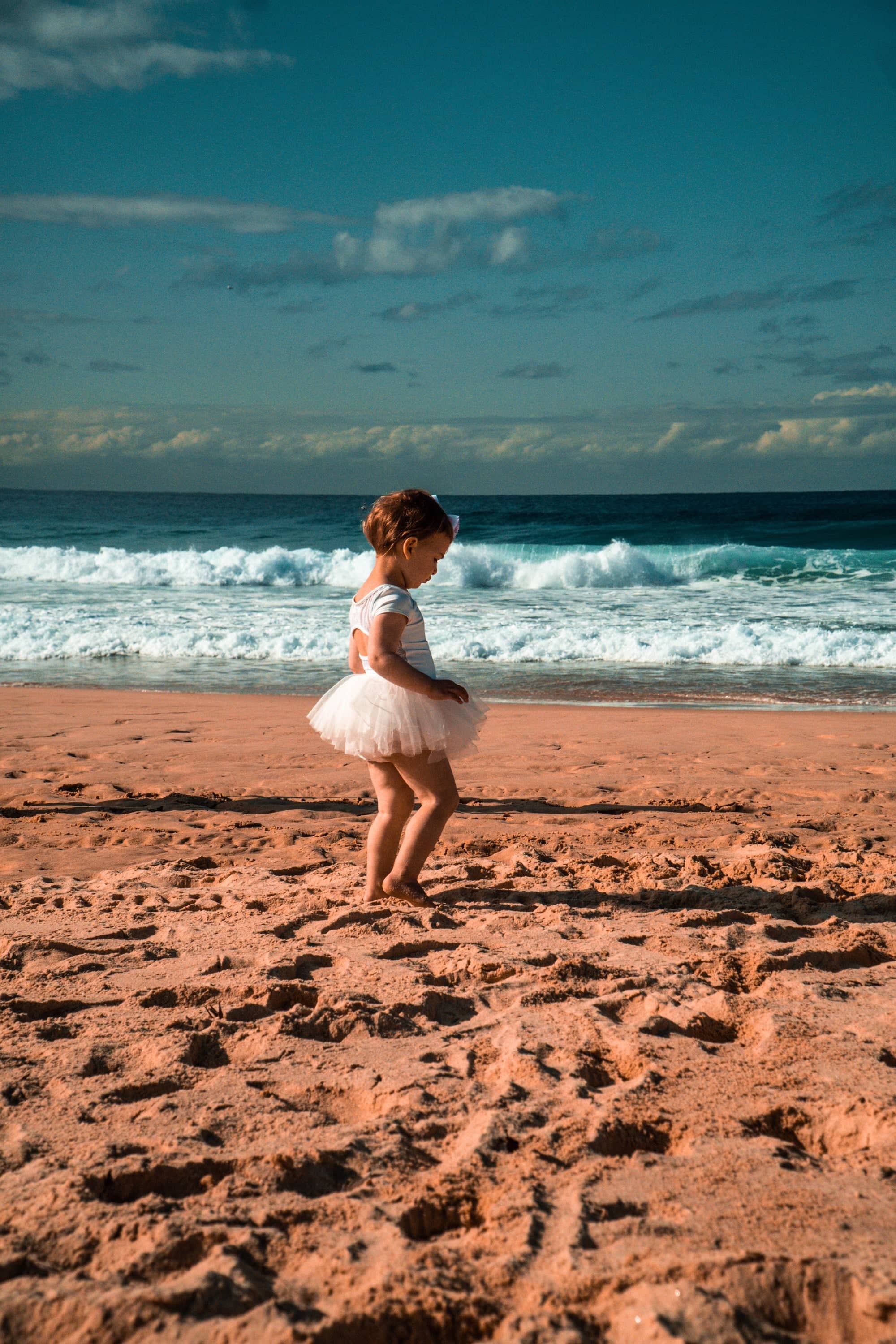Ballerina on the beach walking